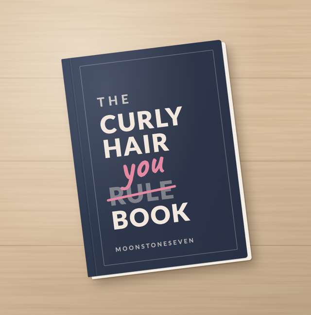 Book titled “The Curly Hair Rulebook” with “rule” crossed out and replaced by “you,” by MoonstoneSeven