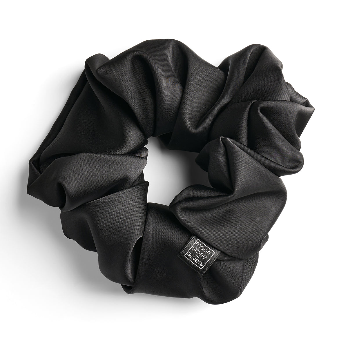 Black satin scrunchie for curly and wavy hair, gentle on strands and snag-free.