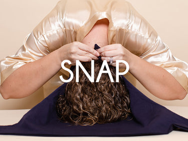Step 1: Snapping the MoonstoneSeven Hair Plop into place before wrapping