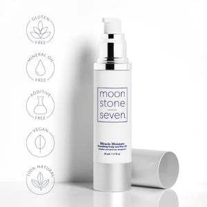 Open bottle of MoonstoneSeven Miracle Moisture Oil with callouts for 100% natural, vegan, additive-free, and mineral oil-free formula