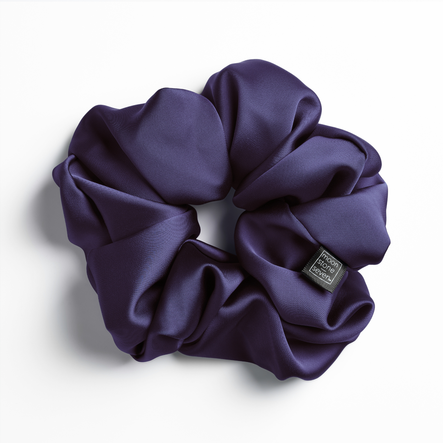 Plum satin scrunchie for curly and wavy hair, gentle on strands and snag-free.