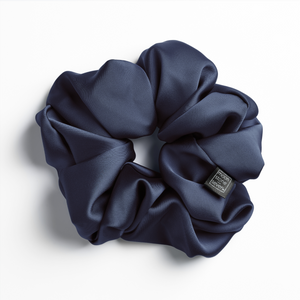 Navy satin scrunchie for curly and wavy hair, gentle on strands and snag-free.